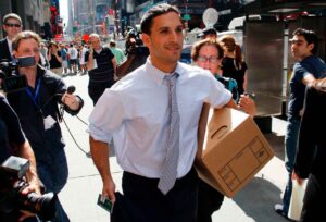 A man walks out of the Lehman Brothers building carrying a box of his belongings in New York September 15, 2008. Lehman Brothers Holdings Inc filed for bankruptcy after trying to finance too many risky assets with too little capital, becoming the largest and highest-profile casualty of the global credit crisis. Based on assets, Lehman far surpassed WorldCom as the largest U.S. bankruptcy ever. Lehman had assets of $639 billion at the end of May, while WorldCom had $107 billion when it filed for bankruptcy protection in 2002. REUTERS/Joshua Lott (UNITED STATES)